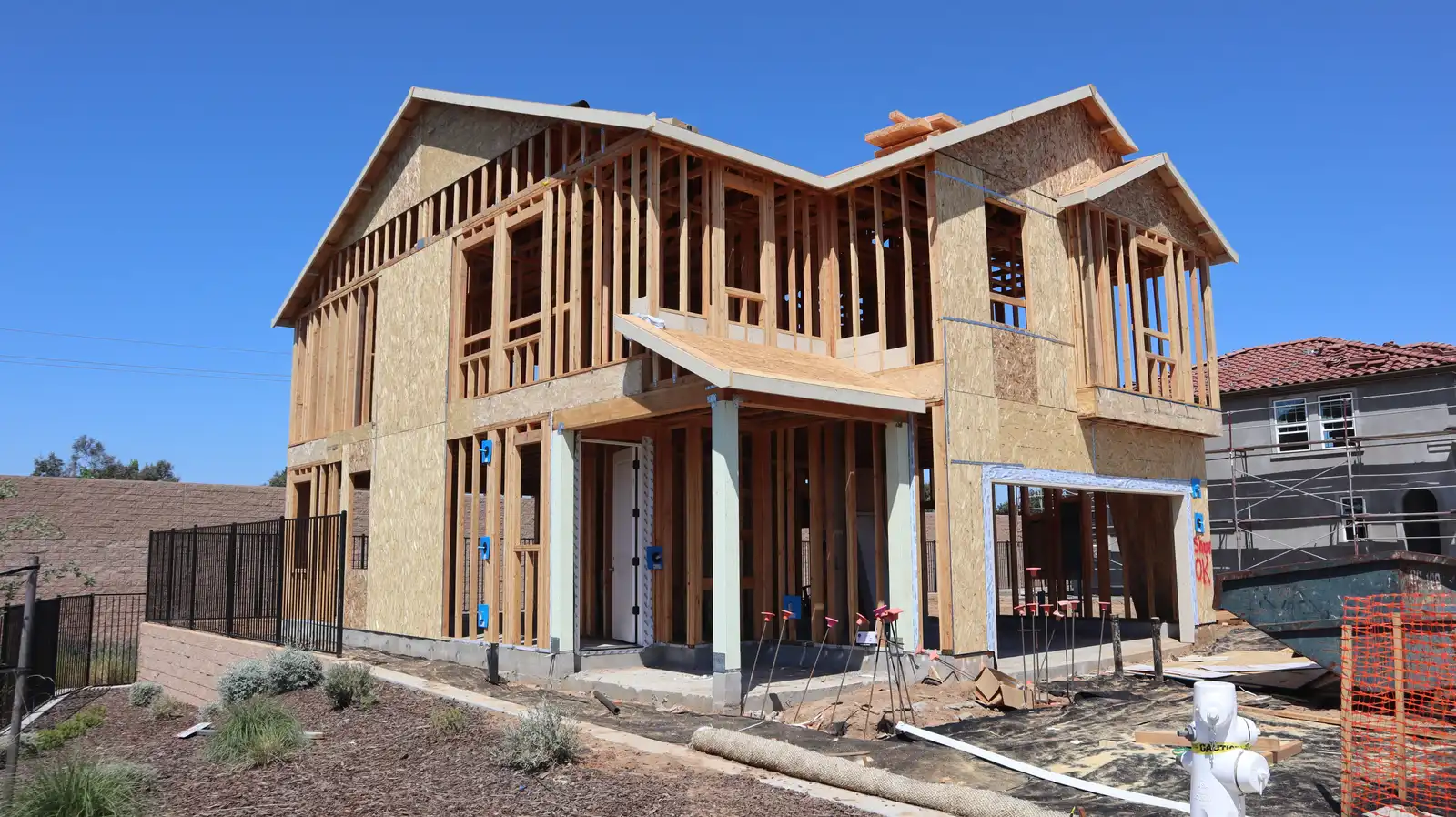 Before: new home exterior at the framing and substrate stage