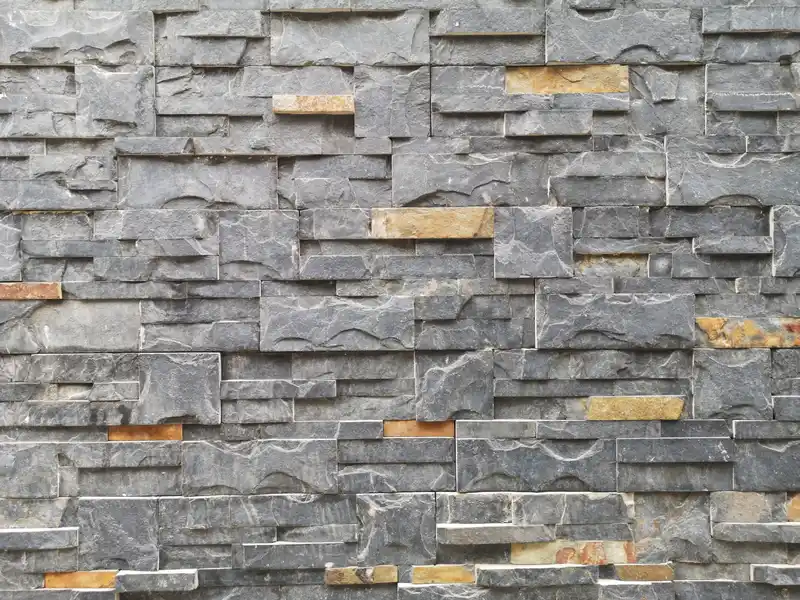 Coursed stone veneer cladding installed on a Chicagoland custom home