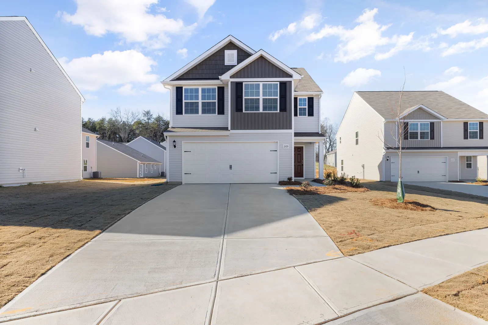 After: brand new custom home exterior with finished chimney construction