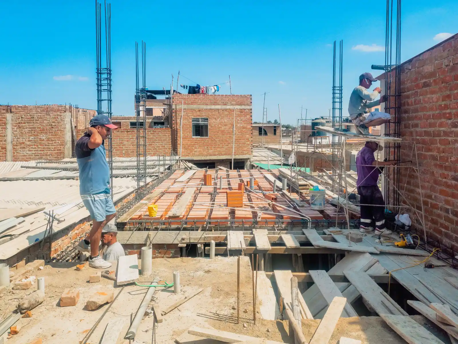 Roofline and chimney construction work on a home addition