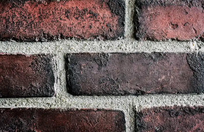 Close-up of fresh mortar joints between brick, tuckpointing detail