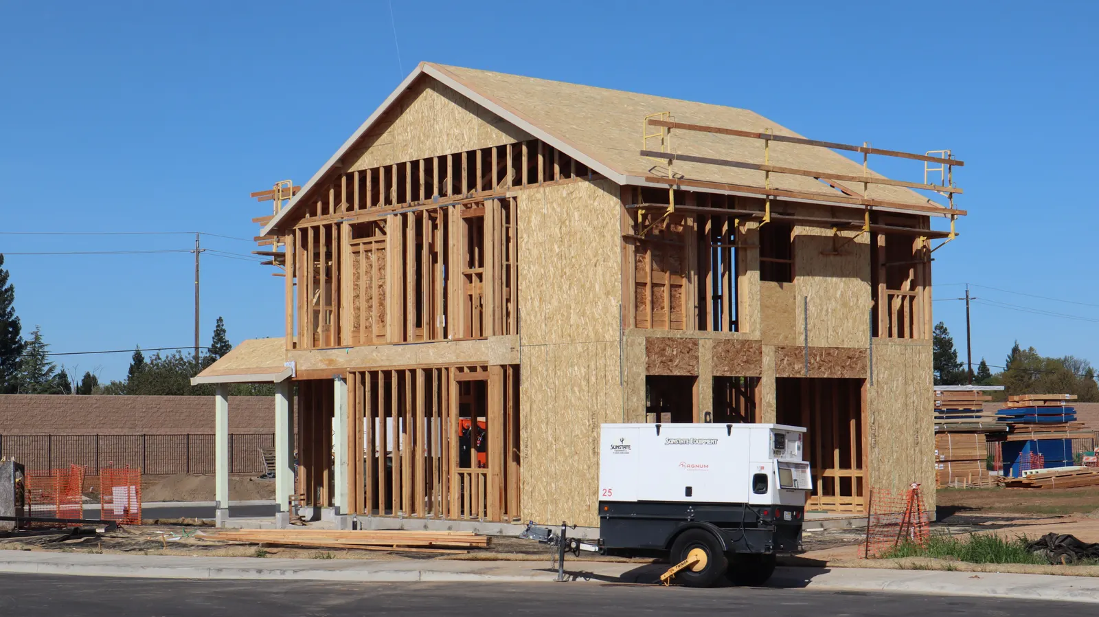 Our Vision — new two-story home under construction, framed and ready for masonry