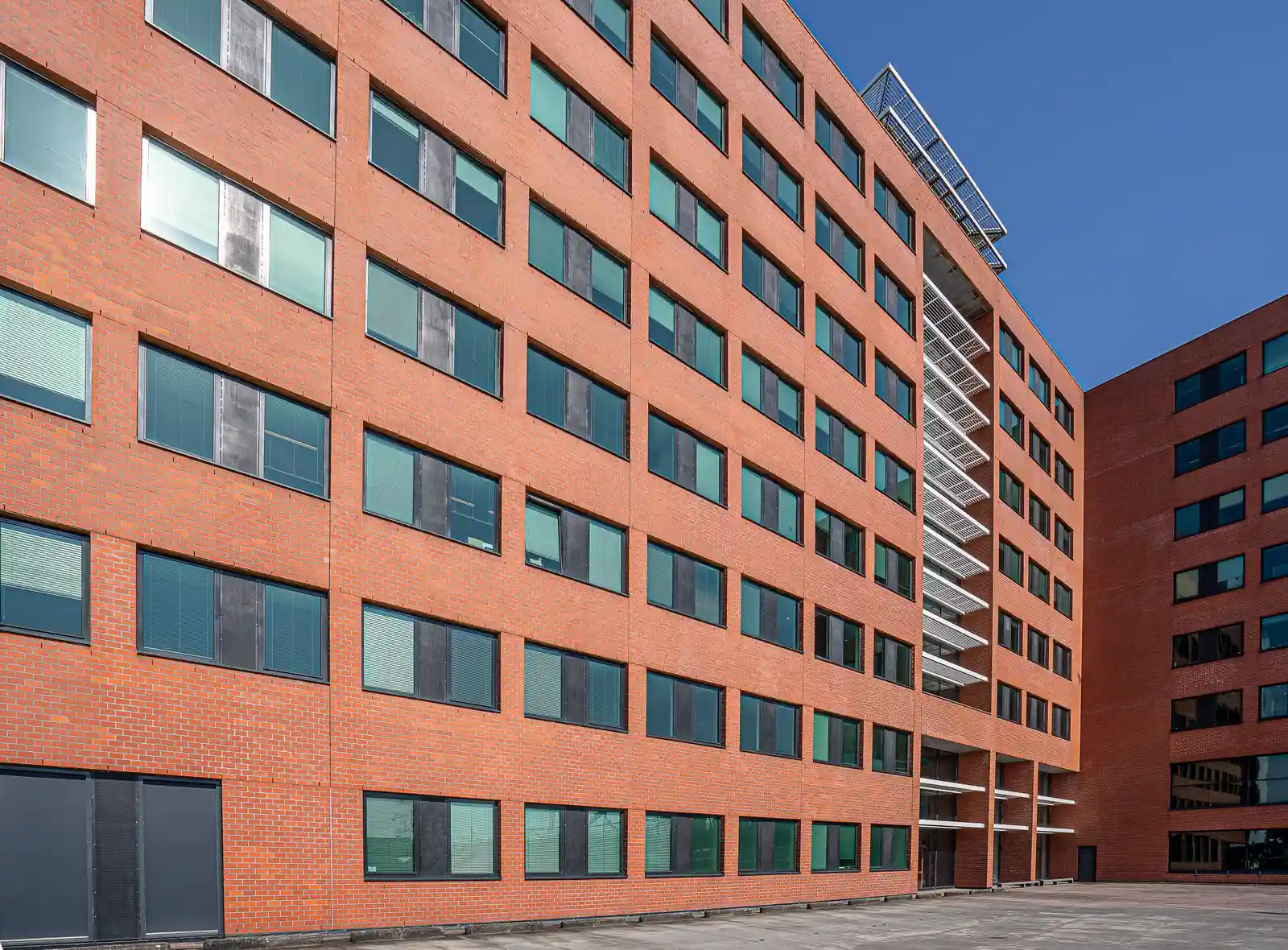Large-scale commercial brick and stone masonry building exterior