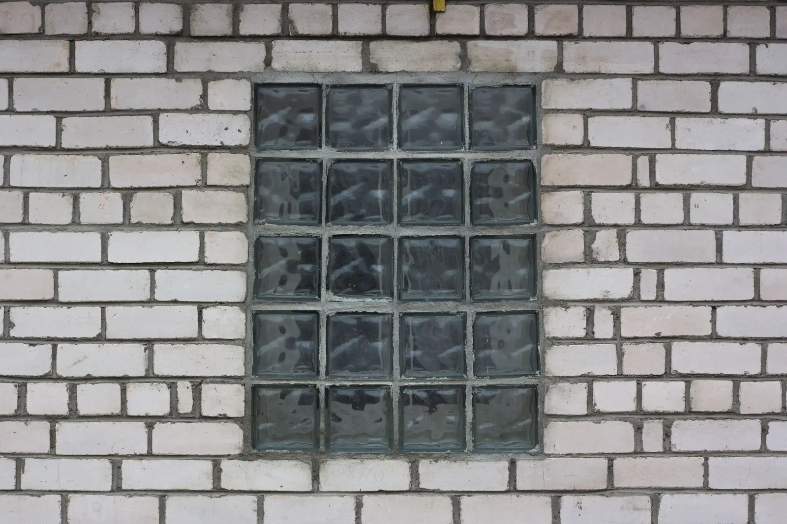 Concrete masonry unit (CMU) block wall for commercial load-bearing construction