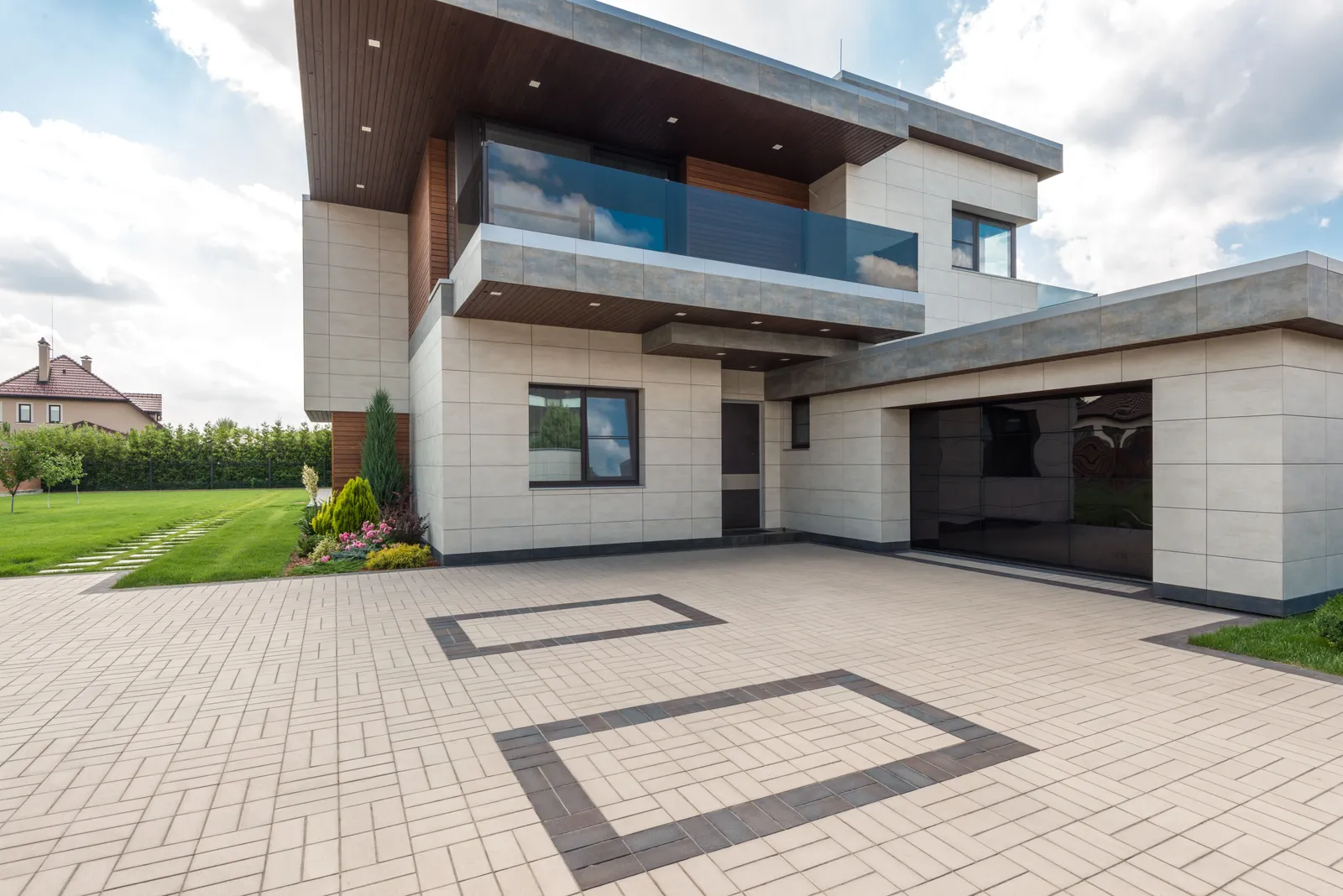 New custom home with residential brick and stone veneer exterior
