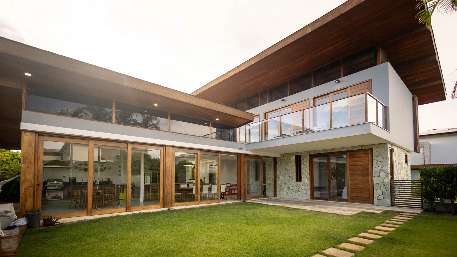 Our Vision — finished luxury custom home with stone accent wall and landscaping