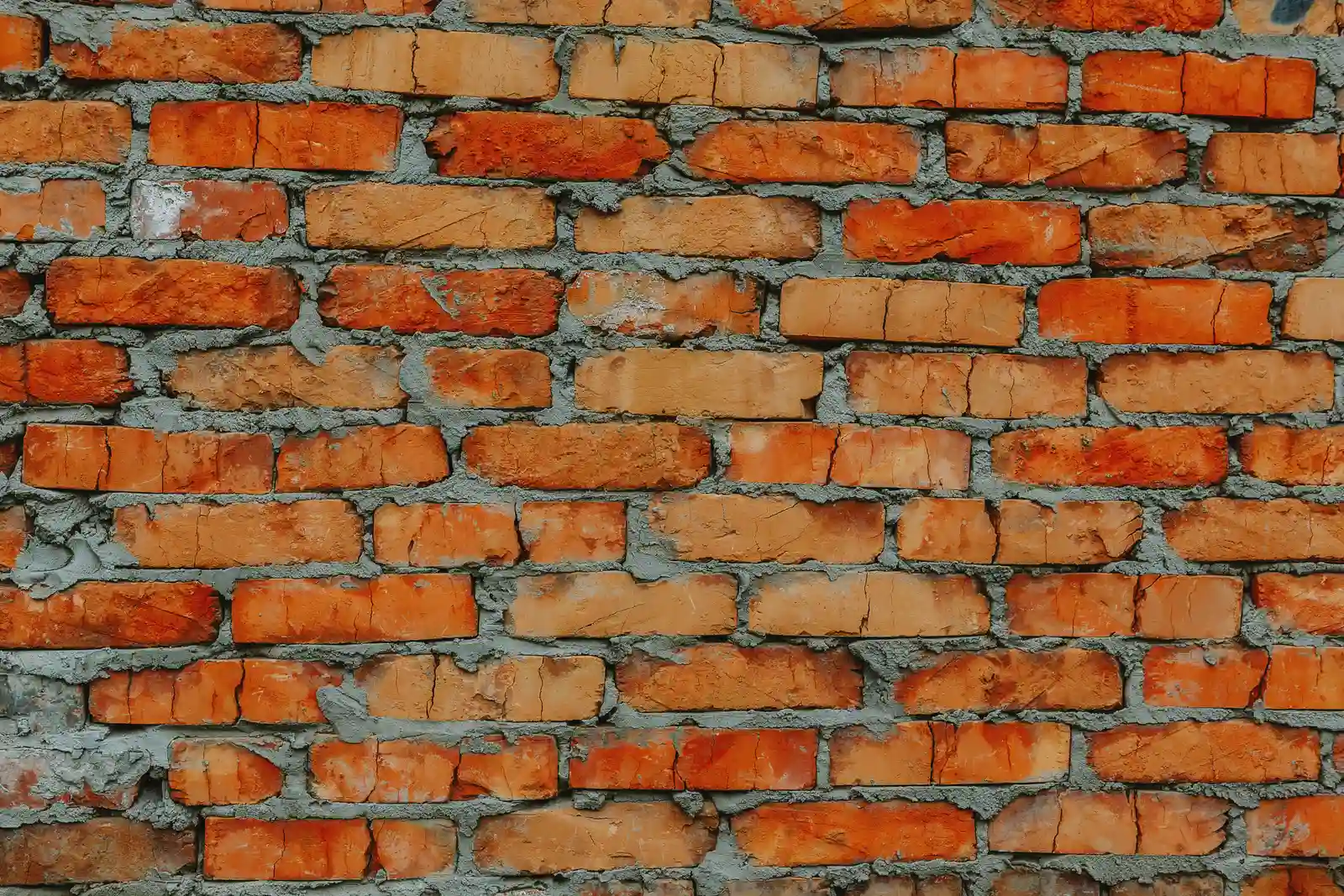 Close-up of repointed brick wall with fresh mortar joints