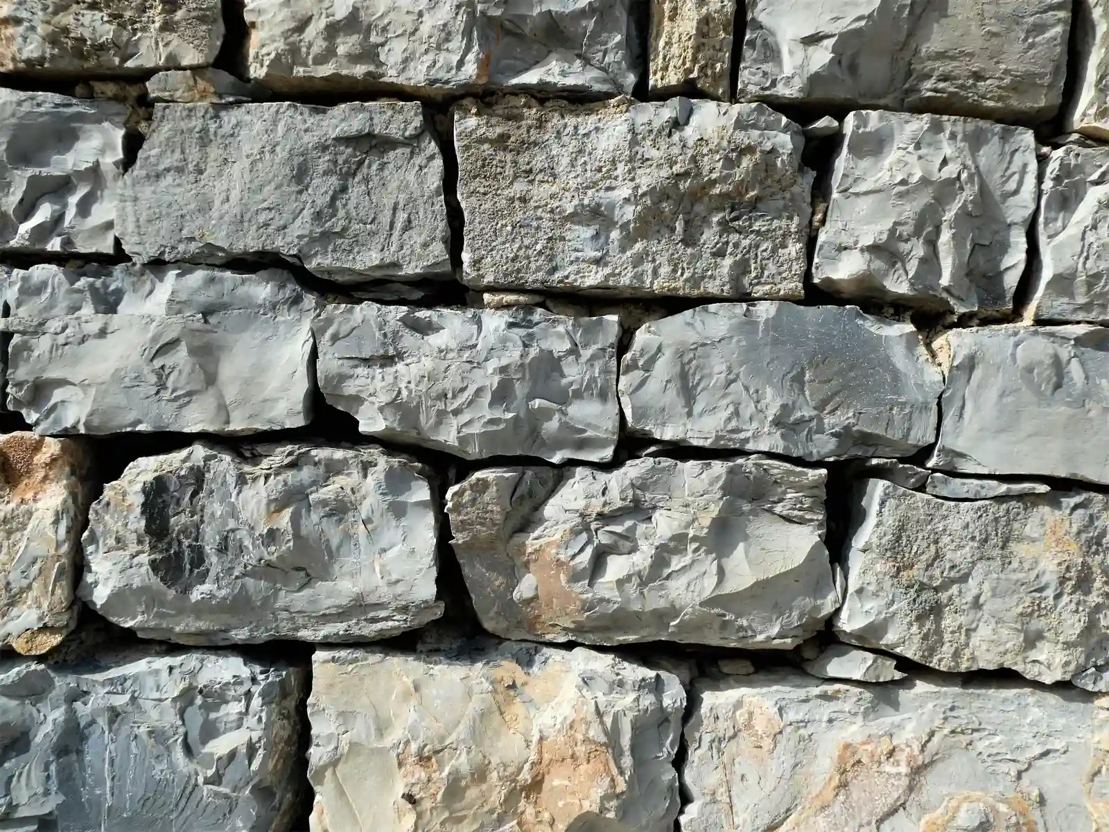 Modern custom home exterior with stone panel cladding and wood accents