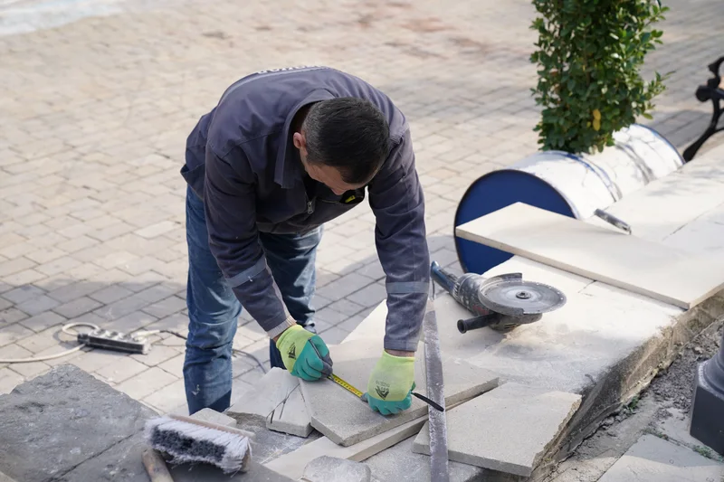 In-house AMS stone mason dressing a limestone block