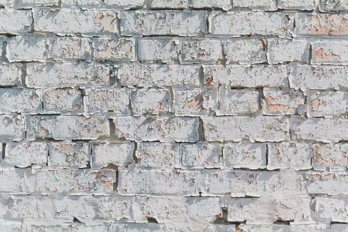 Before: Window surround — frost-damaged brick around opening replaced, lintel inspected and sealed