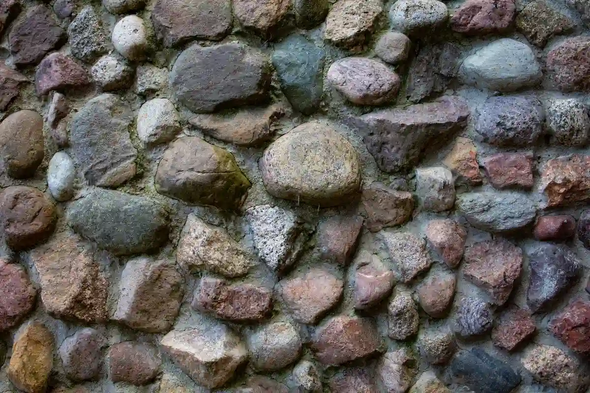 Before: Front wall — natural stone veneer installed over drainage mat with back-butter mortar