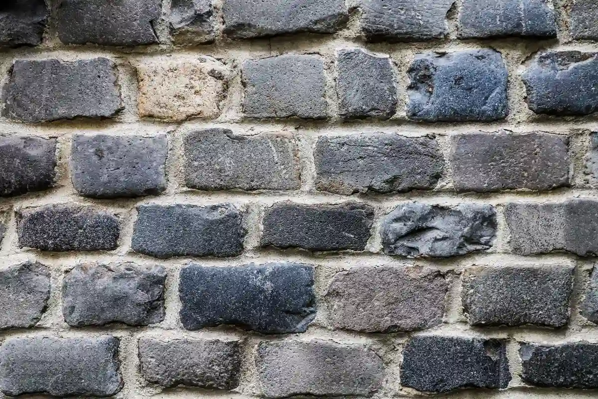 Before: Main facade — joints repointed with custom color-matched mortar, tooled to original profile