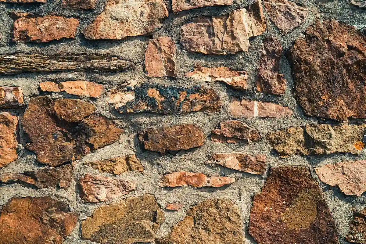 After: Side elevation — full-depth repointing with consistent joint lines across the wall