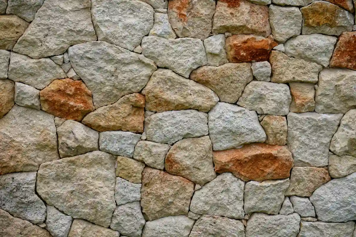 After: Front elevation — stone veneer installed over continuous drainage plane with anchored ties