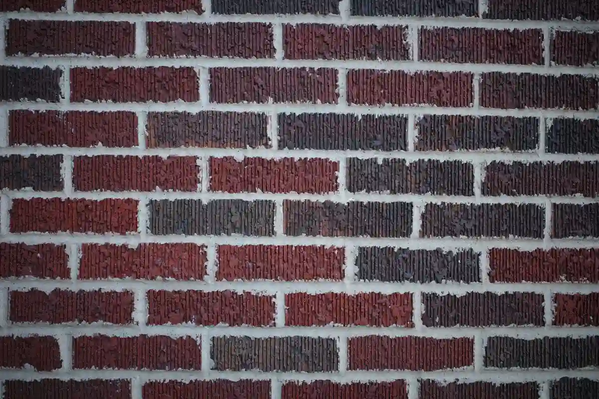 Before: Side elevation — full-depth repointing with consistent joint lines across the wall