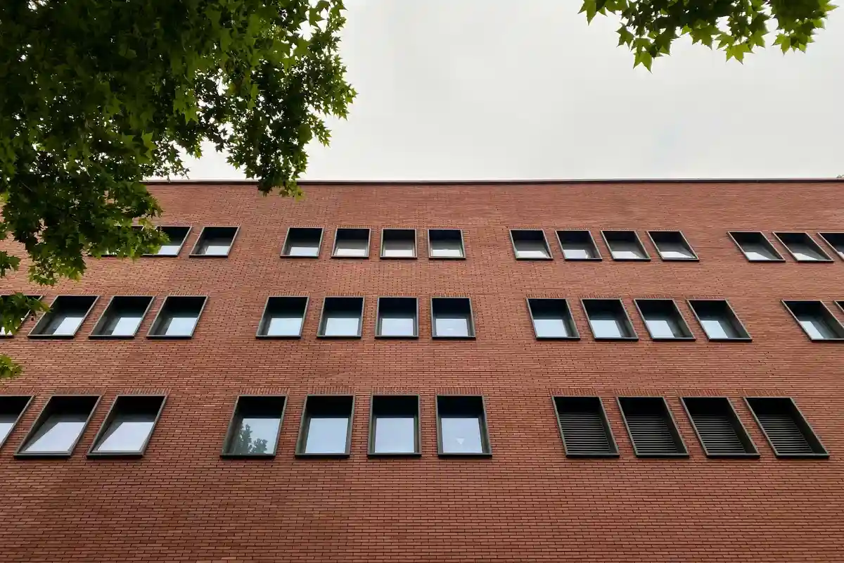 After: Main elevation — commercial brick installed with consistent coursing across the full facade