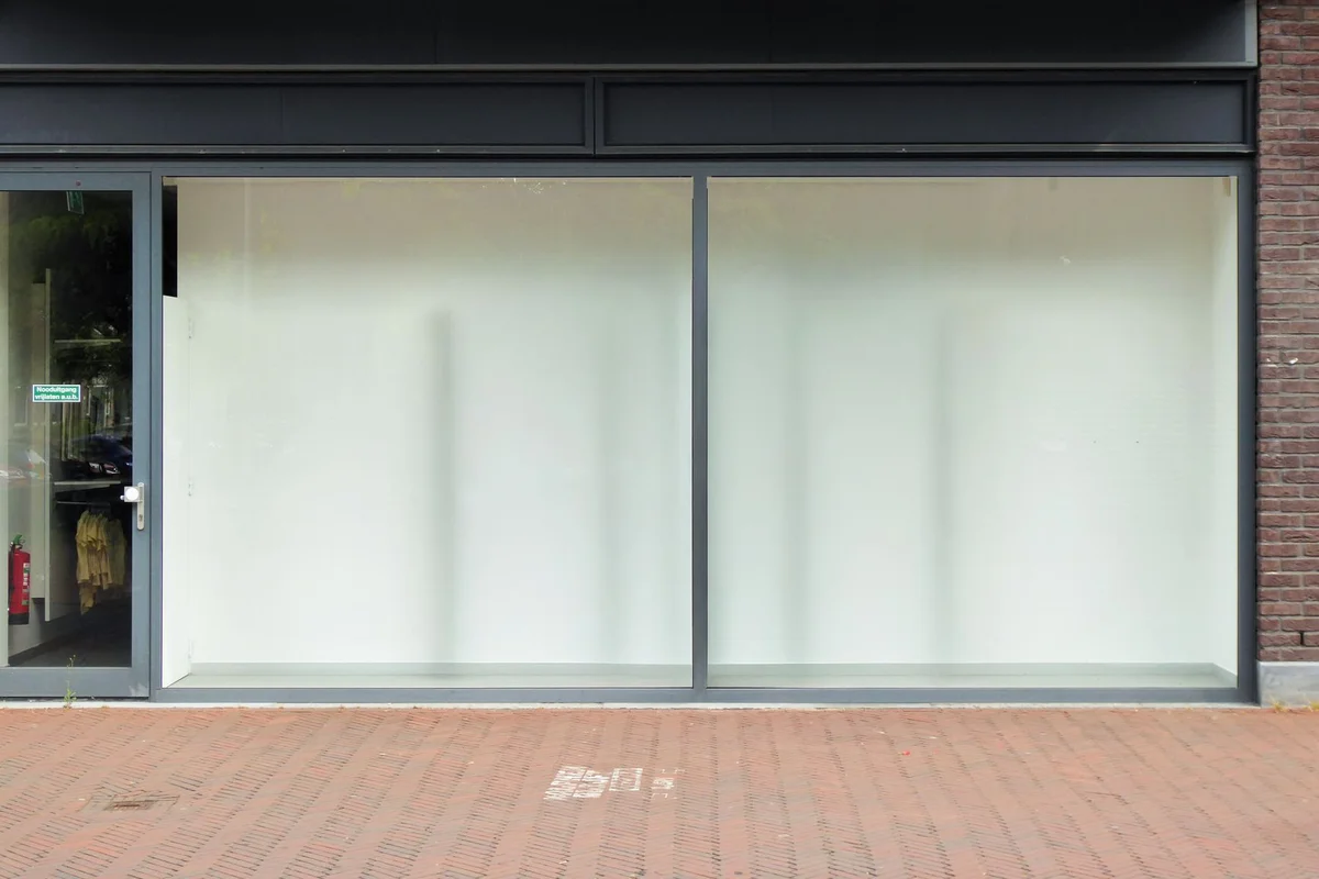 After: Storefront level — stone and brick detailing executed to architectural specification