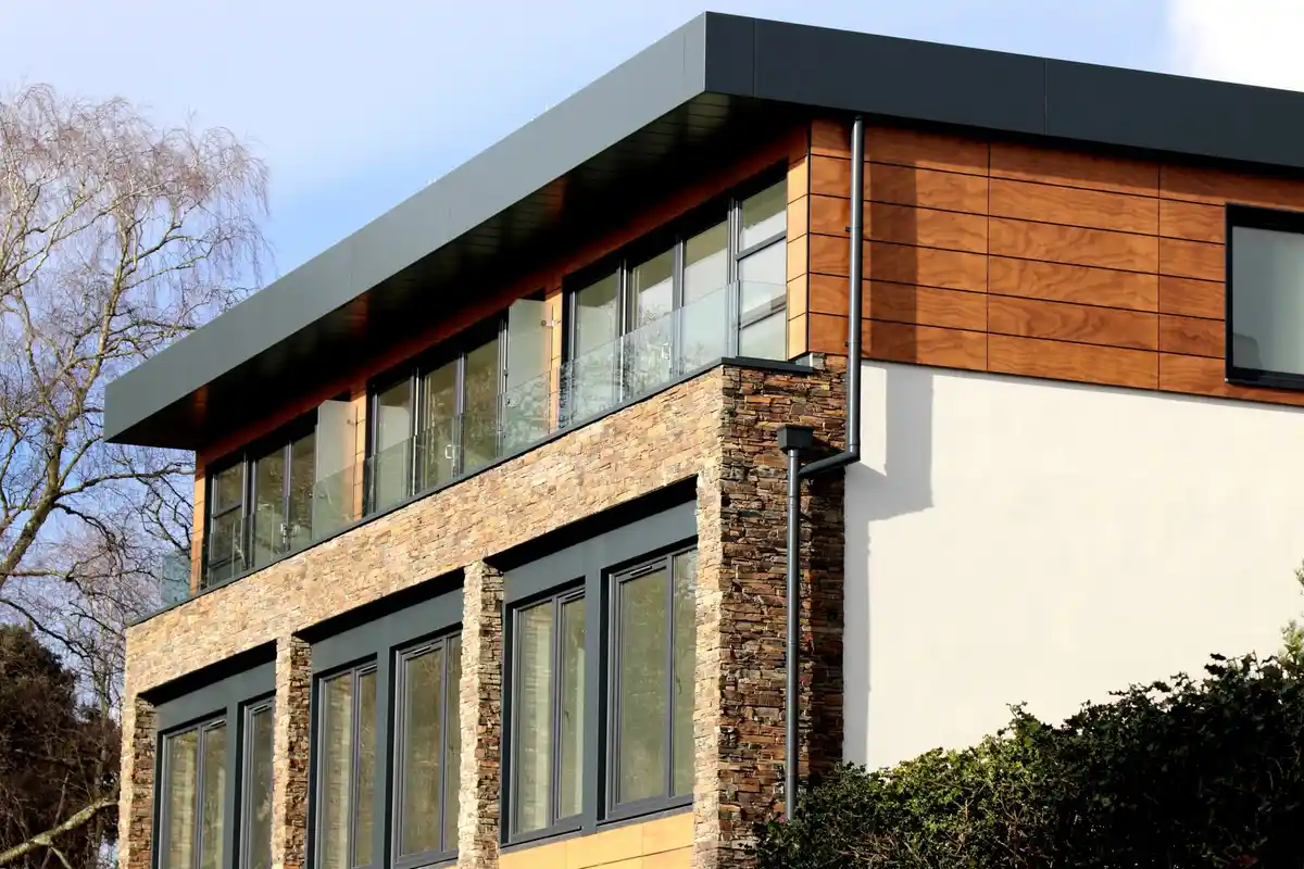 After: Entry surround — stone and brick transition detailed as one coherent design
