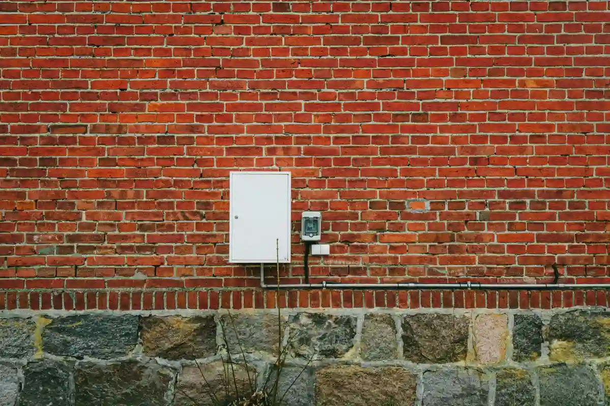 Before: Entry surround — stone and brick transition detailed as one coherent design