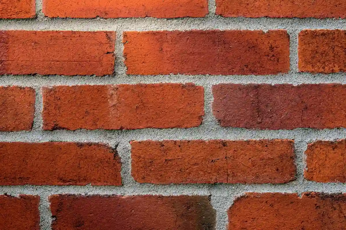 Before: Side elevation — full-depth repointing with consistent joint lines across the wall