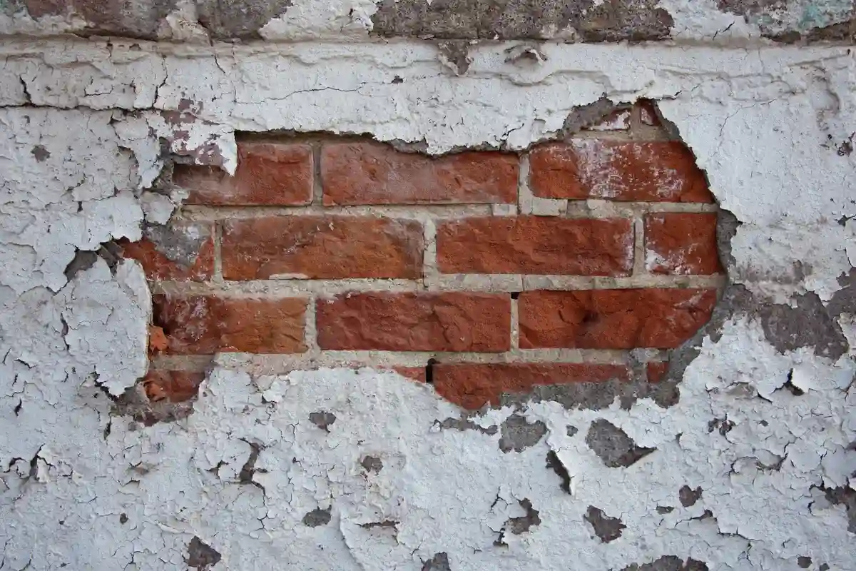 Before: Main wall section — spalling brick removed and replaced with matched clay brick units