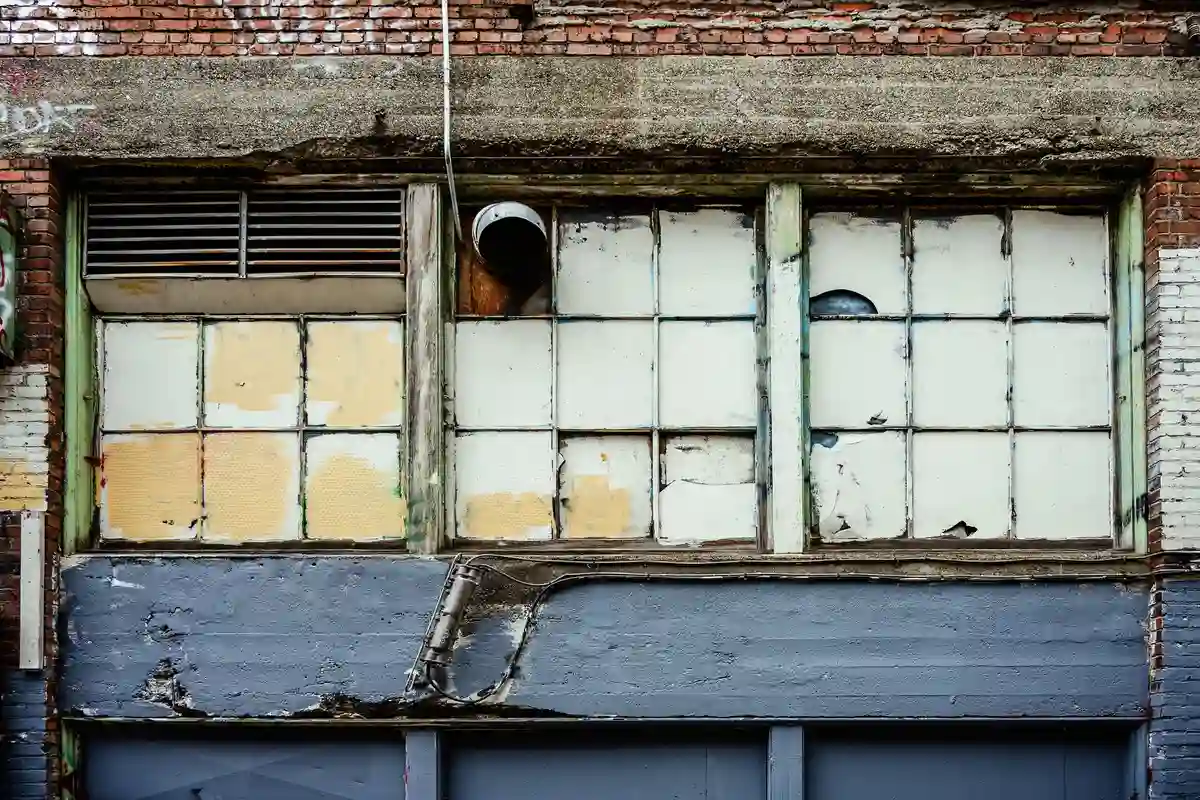 Before: Storefront level — stone and brick detailing executed to architectural specification