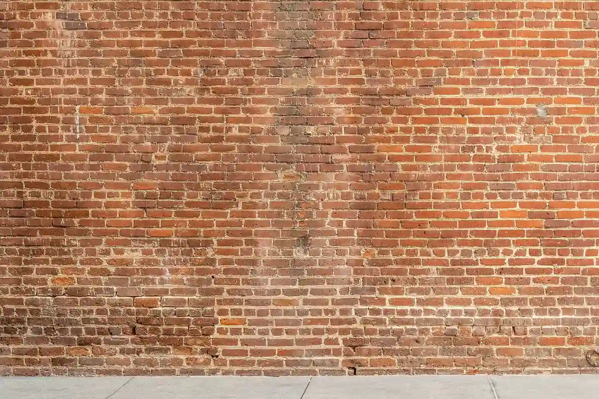 Before: Side elevation — full-depth repointing with consistent joint lines across the wall