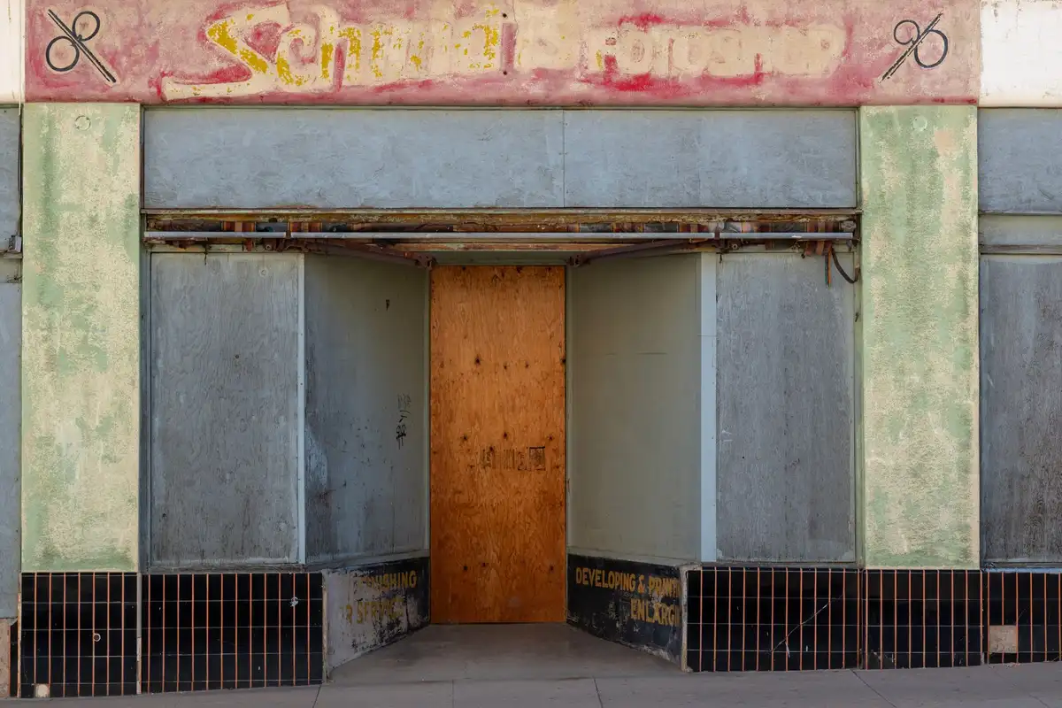 Before: Storefront level — stone and brick detailing executed to architectural specification