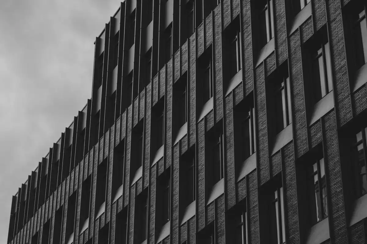 After: Main elevation — commercial brick installed with consistent coursing across the full facade