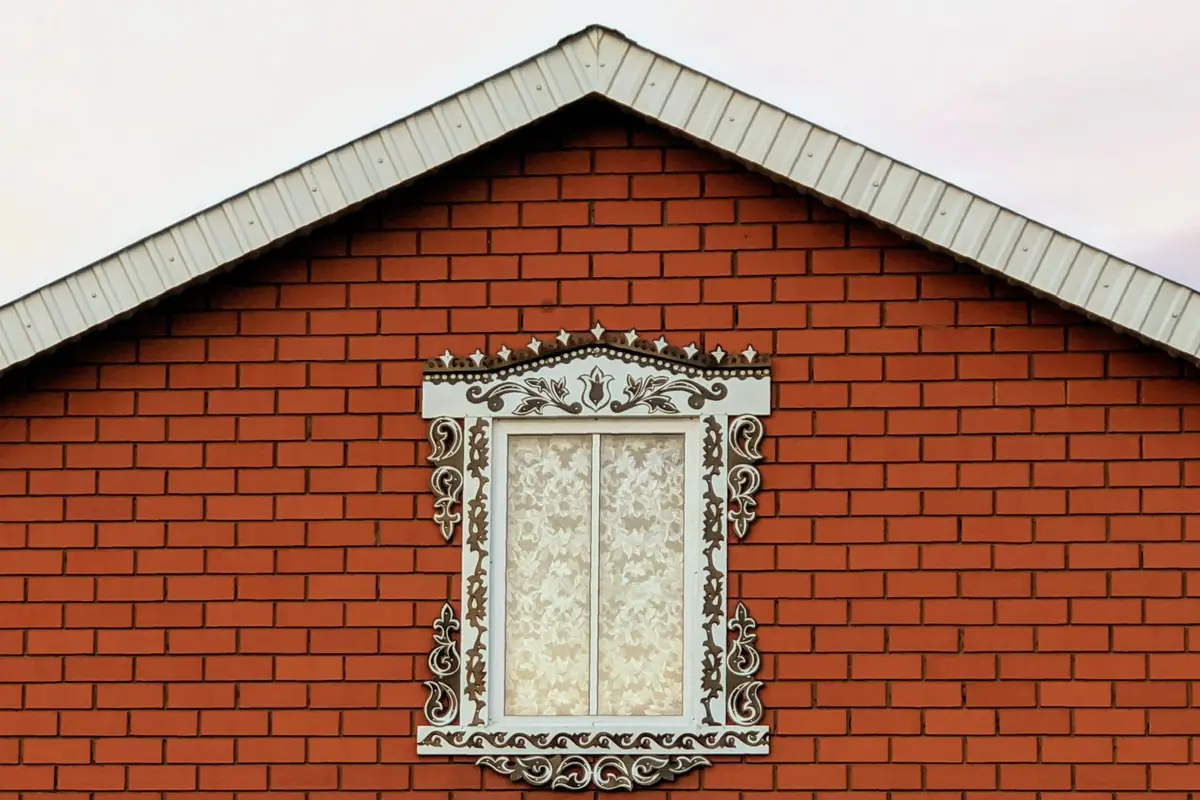 After: Side elevation — brick installation over engineered tie and flashing system
