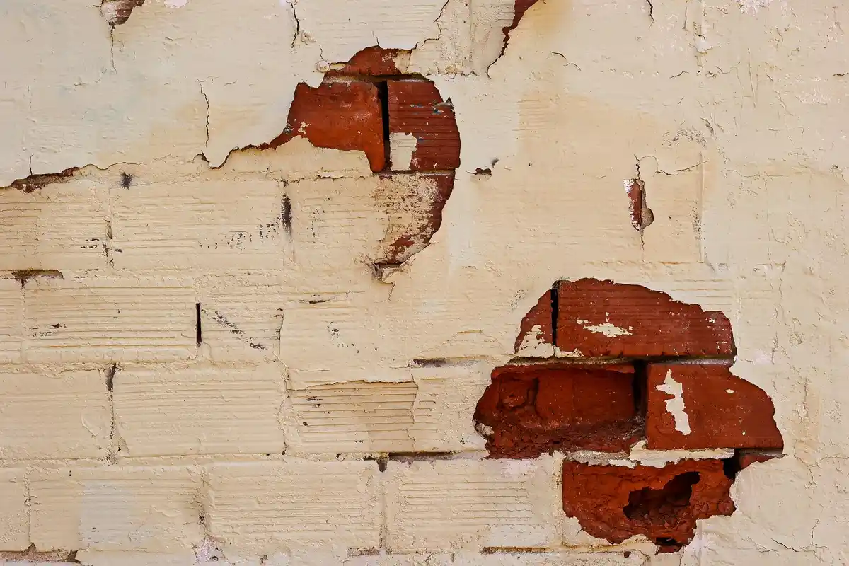 Before: Side elevation — brick installation over engineered tie and flashing system