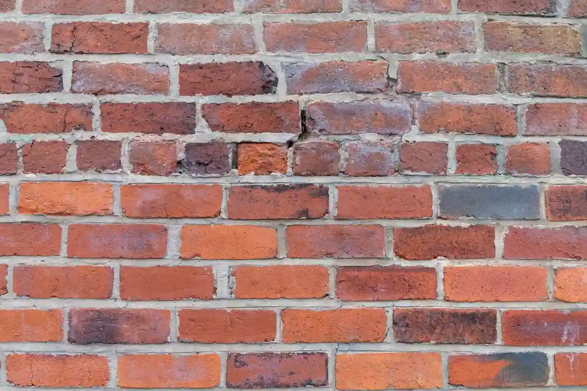 After: Main facade — joints repointed with custom color-matched mortar, tooled to original profile