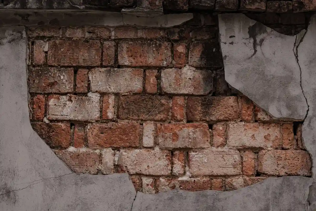 Before: Corner detail — damaged corner brick replaced and repointed with color-matched mortar