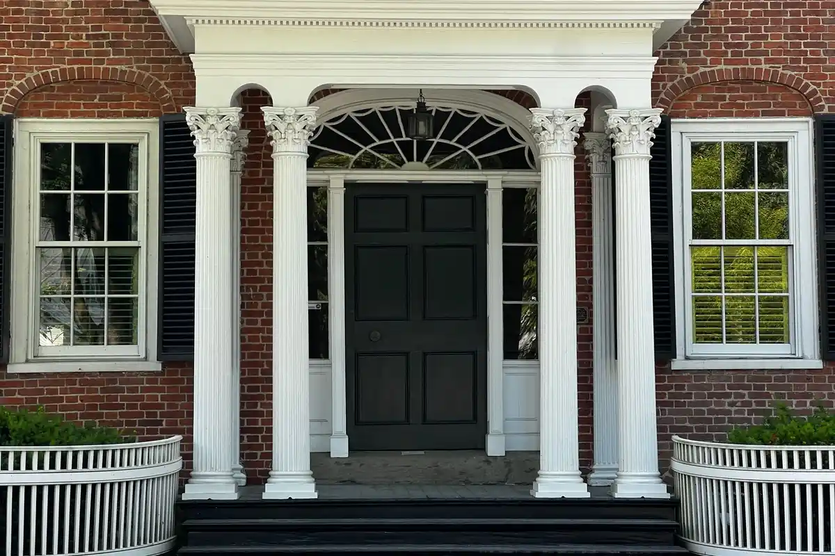 After: Window surround — frost-damaged brick around opening replaced, lintel inspected and sealed