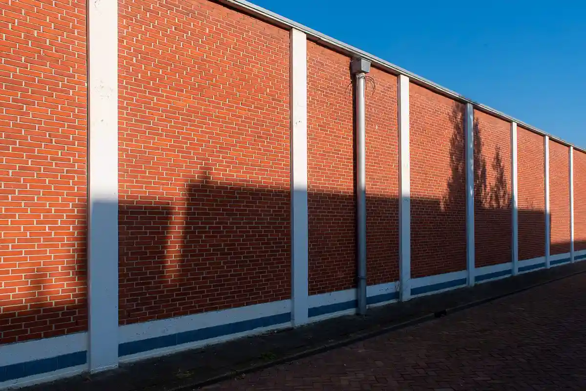 Before: Entry surround — stone and brick transition detailed as one coherent design