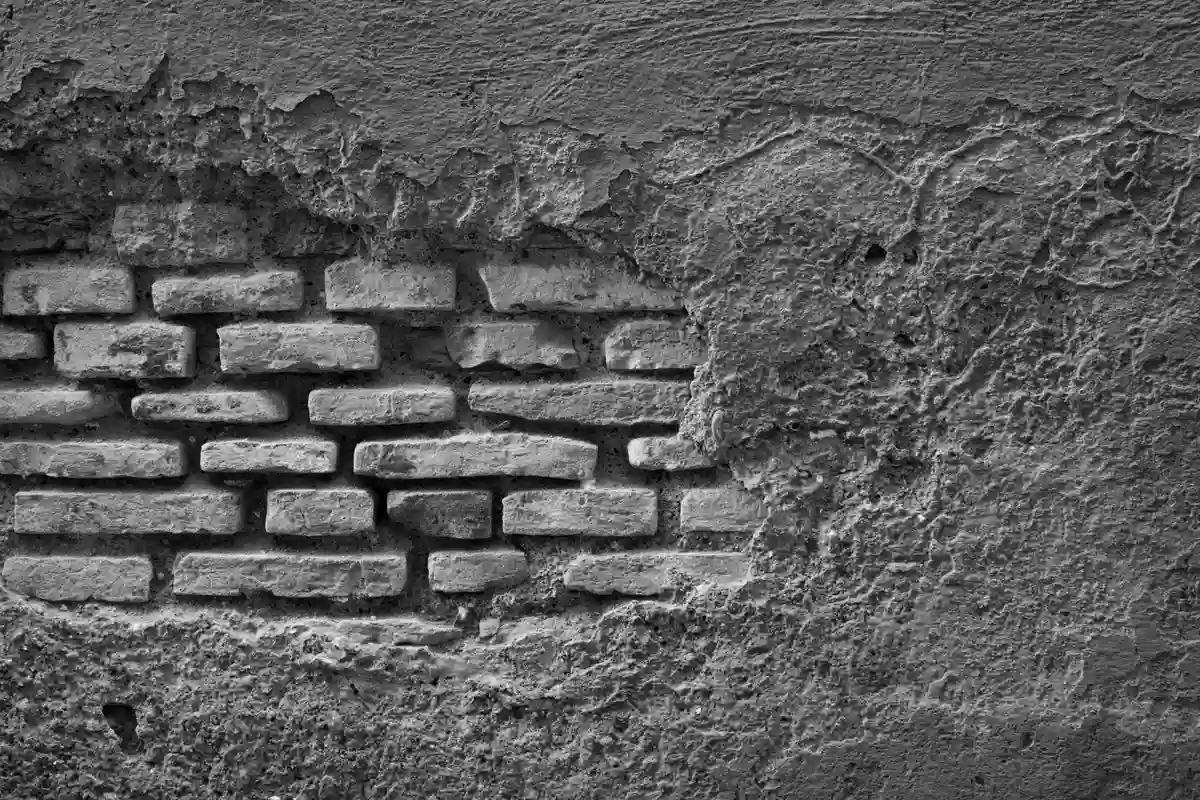 Before: Chimney stack — new masonry chimney with poured crown, stainless cap, and woven flashing