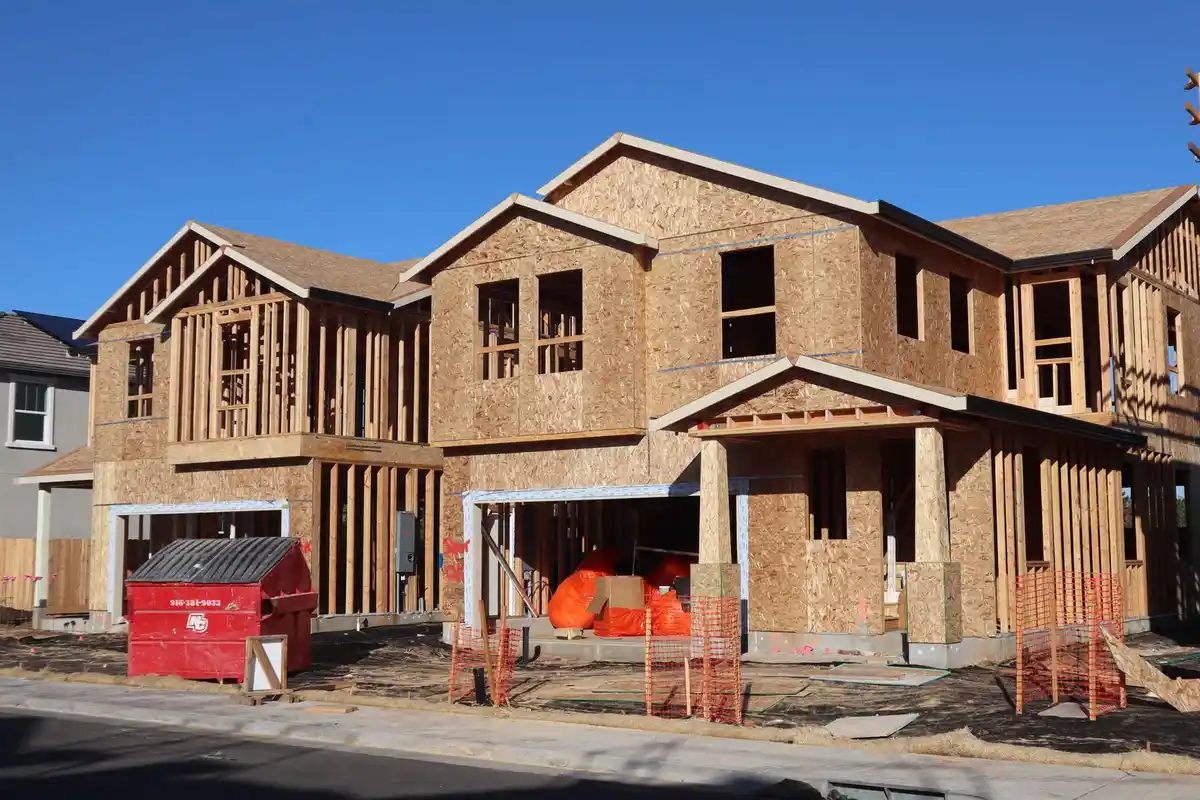 Before: Primary facade — full exterior brick and limestone installation from foundation to roofline