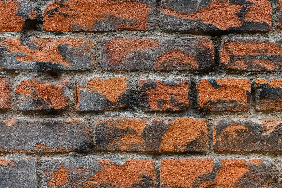 Before: Main elevation — commercial brick installed with consistent coursing across the full facade