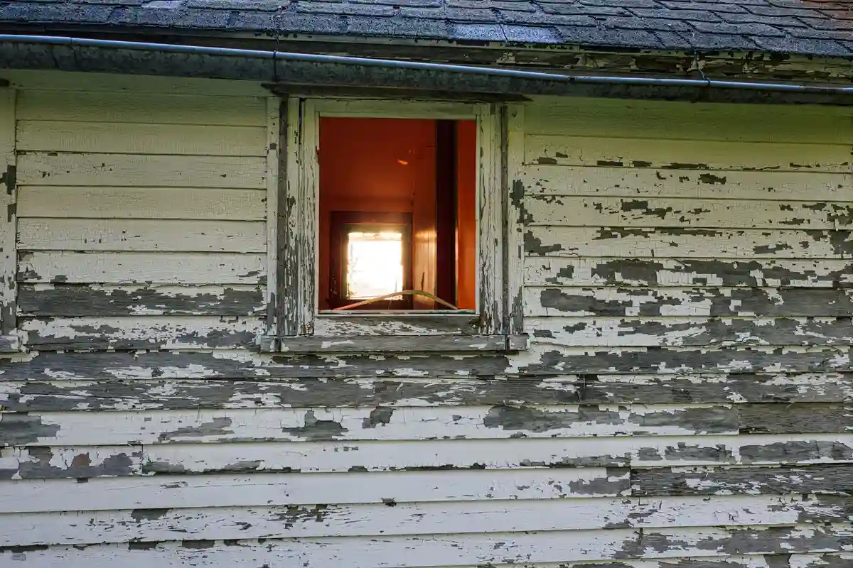 Before: Front elevation — stone veneer installed over continuous drainage plane with anchored ties