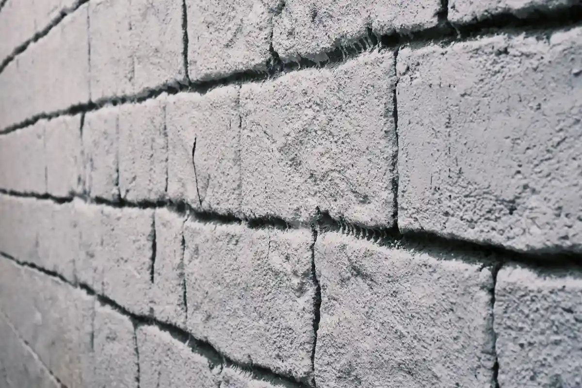 After: Side elevation — full-depth repointing with consistent joint lines across the wall
