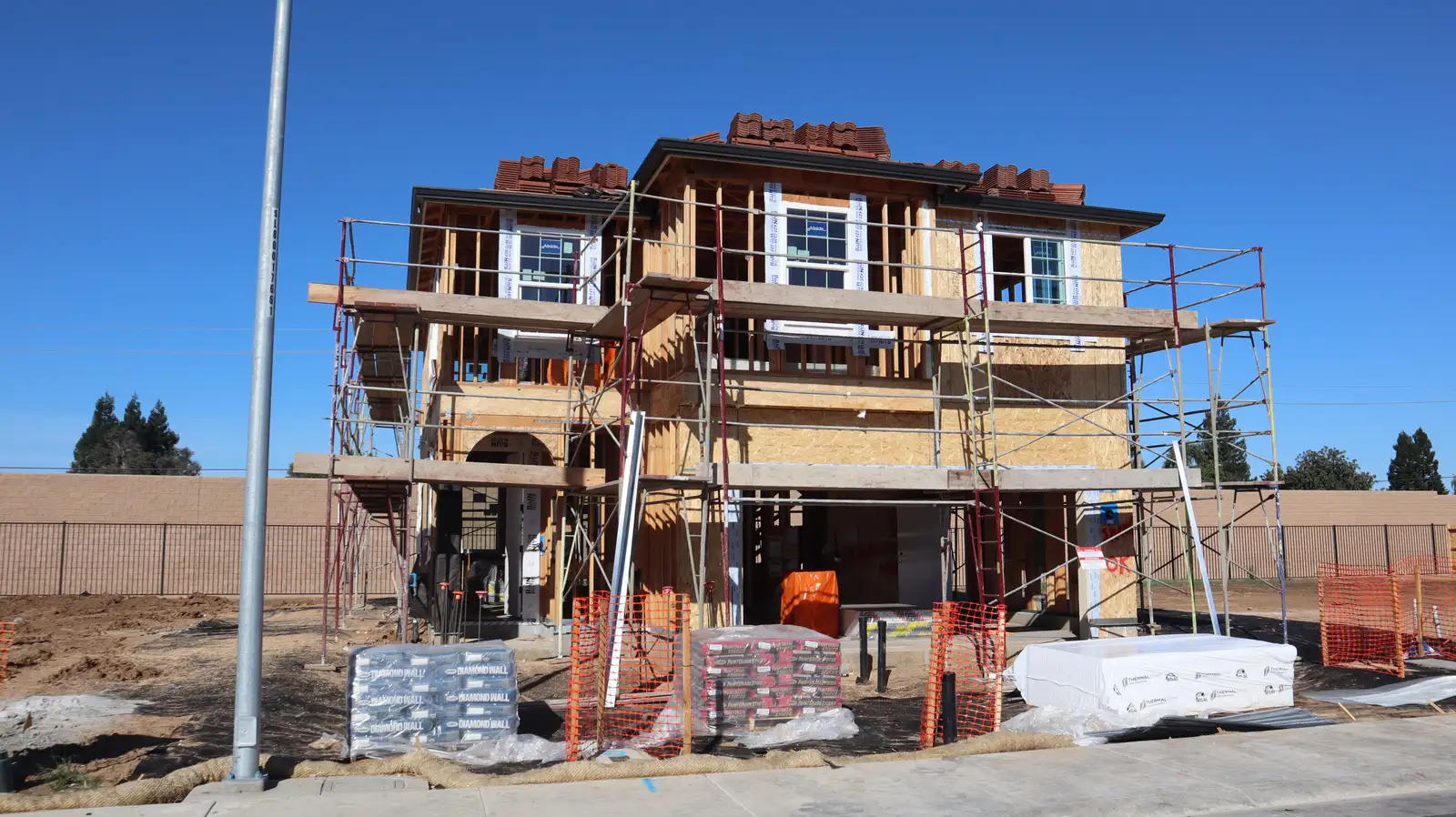 Masonry crew working around framing schedule on a Wilmette custom build